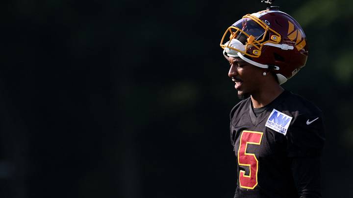 Jul 29, 2026; Ashburn, VA, USA; Washington Commanders quarterback Jayden Daniels (5) stands on the field during a drill on day one of training camp at BigBear.ai Performance Center at Commanders Park. Mandatory Credit: Geoff Burke-Imagn Images Jul 29, 2026; Ashburn, VA, USA; Washington Commanders quarterback Jayden Daniels (5) stands on the field during a drill on day one of training camp at BigBear.ai Performance Center at Commanders Park. Mandatory Credit: Geoff Burke-Imagn Images