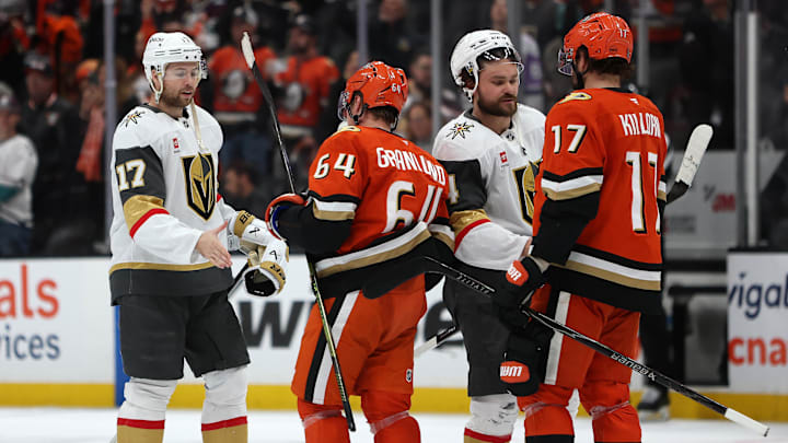 May 14, 2026; Anaheim, California, USA; Vegas Golden Knights defenseman Ben Hutton (17) and defenseman Rasmus Andersson (4) greet Anaheim Ducks center Mikael Granlund (64) and left wing Alex Killorn (17) after game six of the second round of the 2026 Stanley Cup Playoffs at Honda Center. Mandatory Credit: Kiyoshi Mio-Imagn Images