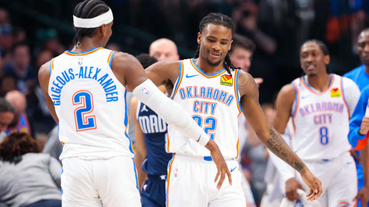 May 11, 2024; Dallas, Texas, USA; Oklahoma City Thunder guard Cason Wallace (22) celebrates with Oklahoma City Thunder guard Shai Gilgeous-Alexander (2) after scoring during the first half against the Dallas Mavericks during game three of the second round for the 2024 NBA playoffs at American Airlines Center. Mandatory Credit: Kevin Jairaj-USA TODAY Sports