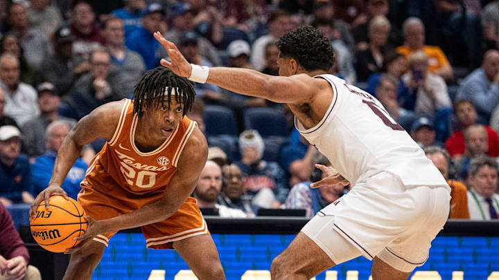 Texas Longhorns guard Tre Johnson (20) looks to pass during their second round game of the SEC Men's Basketball Tournament at Bridgestone Arena in Nashville, Tenn., Thursday, March 13, 2025.