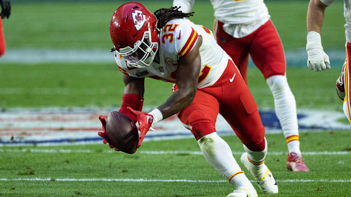 Feb 12, 2023; Glendale, Arizona, US; Kansas City Chiefs linebacker Nick Bolton (32) recovers a fumble against the Philadelphia Eagles in Super Bowl LVII at State Farm Stadium. 