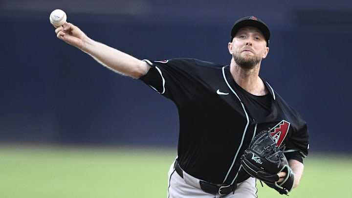 Jul 8, 2025; San Diego, California, USA; Arizona Diamondbacks starting pitcher Merrill Kelly (29) delivers during the first inning against the San Diego Padres at Petco Park. Mandatory Credit: Denis Poroy-Imagn Images