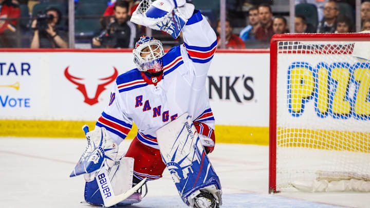 Jan 2, 2020; Calgary, Alberta, CAN; New York Rangers goaltender Henrik Lundqvist (30) makes a save against the Calgary Flames during the first period at Scotiabank Saddledome. Mandatory Credit: Sergei Belski-Imagn Images