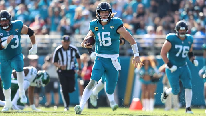 Dec 14, 2025; Jacksonville, Florida, USA; Jacksonville Jaguars quarterback Trevor Lawrence (16) runs the ball during the second quarter against the New York Jets at EverBank Stadium. Mandatory Credit: Morgan Tencza-Imagn Images
