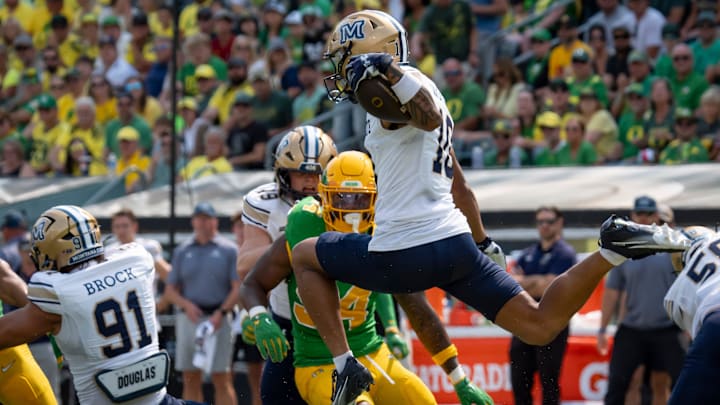 Montana State wide receiver Jabez Woods hurdles through the defense as the Oregon Ducks host the Montana State Bobcats on Aug. 30, 2025, at Autzen Stadium in Eugene, Oregon.