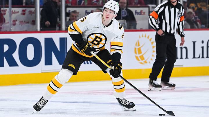 Mar 17, 2026; Montreal, Quebec, CAN; Boston Bruins defenseman Mason Lohrei (6) plays the puck against the Montreal Canadiens during the first period at Bell Centre. Mandatory Credit: David Kirouac-Imagn Images