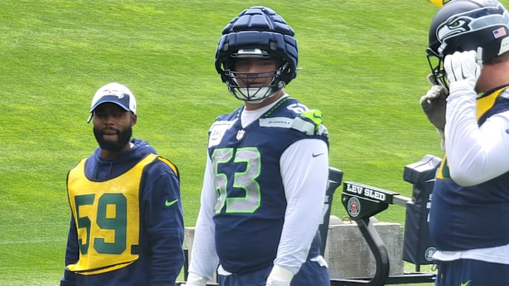 Seahawks rookie guard Sataoa Laumea plays defense on the scout team during a positional drill at OTAs.