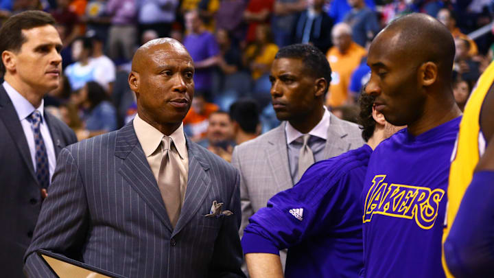Mar 23, 2016; Phoenix, AZ, USA; Los Angeles Lakers head coach Byron Scott (left) and guard Kobe Bryant against the Phoenix Suns at Talking Stick Resort Arena. The Suns defeated the Lakers 119-107. Mandatory Credit: Mark J. Rebilas-Imagn Images Mar 23, 2016; Phoenix, AZ, USA; Los Angeles Lakers head coach Byron Scott (left) and guard Kobe Bryant against the Phoenix Suns at Talking Stick Resort Arena. The Suns defeated the Lakers 119-107. Mandatory Credit: Mark J. Rebilas-Imagn Images