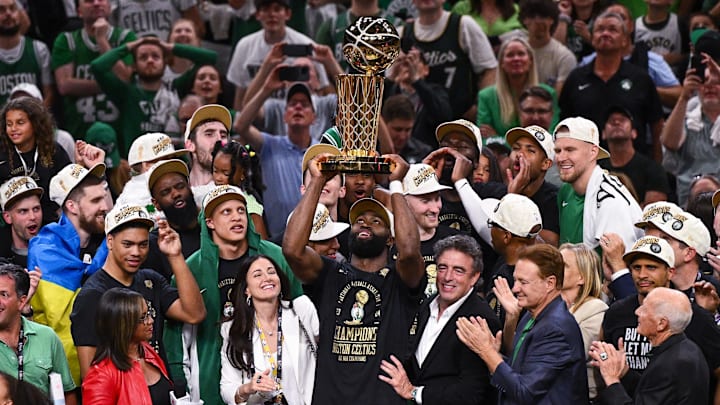 Jaylen Brown holds up the Larry O'Brien Championship Trophy after the Celtics won the 2024 NBA Finals.