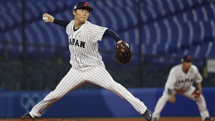 Aug 4, 2021; Yokohama, Japan; Team Japan pitcher Yoshinobu Yamamoto (17) throws a pitch against