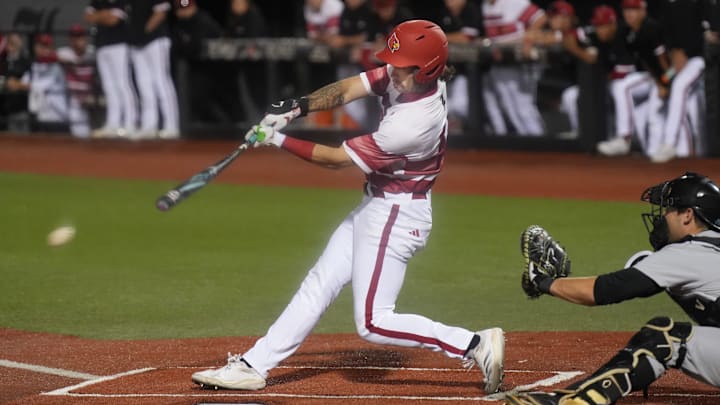 Louisville's outfielder Lucas Moore (53) knocks two runs in against Vanderbilt Tuesday night at Jim Patterson Stadium. Louisville's outfielder Lucas Moore (53) knocks two runs in against Vanderbilt Tuesday night at Jim Patterson Stadium.