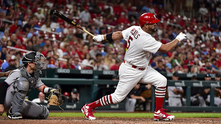 Jun 28, 2022; St. Louis, Missouri, USA;  St. Louis Cardinals designated hitter Albert Pujols (5) hits a single against the Miami Marlins during the eighth inning at Busch Stadium. Mandatory Credit: Jeff Curry-Imagn Images