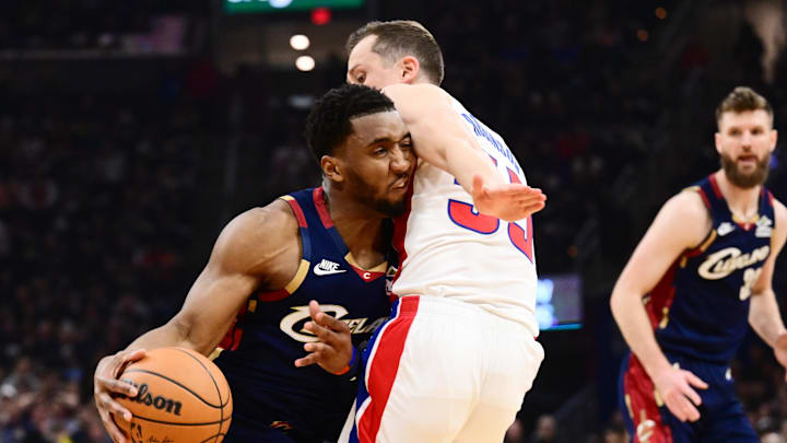 May 15, 2026; Cleveland, Ohio, USA; Cleveland Cavaliers guard Donovan Mitchell (45) drives to the basket against Detroit Pistons forward Duncan Robinson (55) during the first half in game six of the second round of the 2026 NBA Playoffs at Rocket Arena. Mandatory Credit: Ken Blaze-Imagn Images