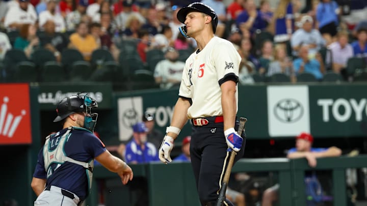 Jun 27, 2025; Arlington, Texas, USA;  Texas Rangers shortstop Corey Seager (5) reacts after striking out during the sixth inning against the Seattle Mariners at Globe Life Field.