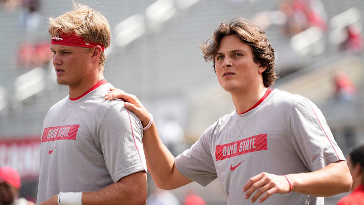 Ohio State quarterbacks Julian Sayin (10) and Lincoln Kienholz (3) warm up prior to the 2024 season opener against the Akron Zips.