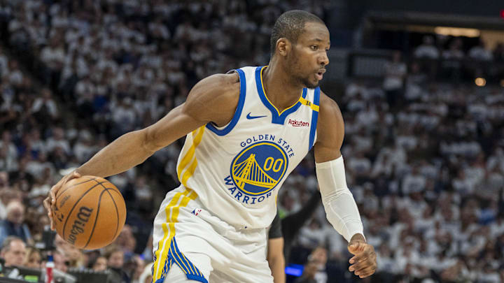 May 8, 2025; Minneapolis, Minnesota, USA; Golden State Warriors forward Jonathan Kuminga (00) dribbles the ball against the Minnesota Timberwolves in the second half during game two of the second round for the 2025 NBA Playoffs at Target Center. Mandatory Credit: Jesse Johnson-Imagn Images