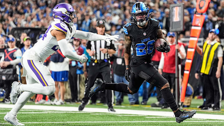 Detroit Lions running back Jahmyr Gibbs (26) runs for a touchdown against Minnesota Vikings safety Camryn Bynum (24) during the second half at Ford Field in Detroit on Sunday, Jan. 5, 2025. Detroit Lions running back Jahmyr Gibbs (26) runs for a touchdown against Minnesota Vikings safety Camryn Bynum (24) during the second half at Ford Field in Detroit on Sunday, Jan. 5, 2025.