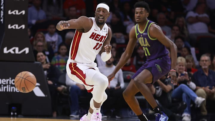 Jan 1, 2025; Miami, Florida, USA; Miami Heat center Bam Adebayo (13) and New Orleans Pelicans center Yves Missi (21) chase a loose ball during the first half at Kaseya Center. Mandatory Credit: Rhona Wise-Imagn Images Jan 1, 2025; Miami, Florida, USA; Miami Heat center Bam Adebayo (13) and New Orleans Pelicans center Yves Missi (21) chase a loose ball during the first half at Kaseya Center. Mandatory Credit: Rhona Wise-Imagn Images