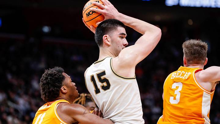Purdue center Zach Edey (15) is defended by Tennessee forward Tobe Awaka (11) and guard Dalton