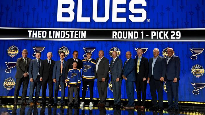 Jun 28, 2023; Nashville, Tennessee, USA; St. Louis Blues draft pick Theo Lindstein stands with Blues staff after being selected with the twenty ninth pick in round one of the 2023 NHL Draft at Bridgestone Arena. Mandatory Credit: Christopher Hanewinckel-Imagn Images