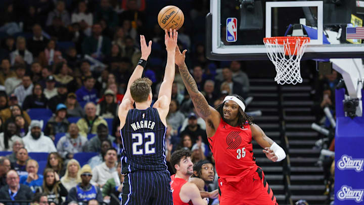 Orlando Magic forward Franz Wagner (22) shoots against Portland Trail Blazers center Robert Williams III (35) during the second half at Kia Center.