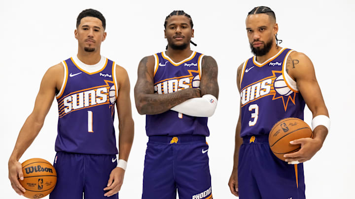 Sep 24, 2025; Phoenix, AZ, USA; Phoenix Suns guard Devin Booker (1), forward Dillon Brooks (3) and guard Jalen Green (4) pose for portrait during Media Day at PHX Arena. Mandatory Credit: Mark J. Rebilas-Imagn Images