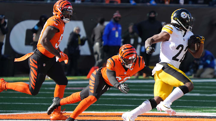 Bengals defense attempts to stop Steelers offense during their game against the Steelers Najee Harris (22) at Paycor Stadium on Sunday December 1, 2024. Steelers lead the game at halftime with a score of 27-21.