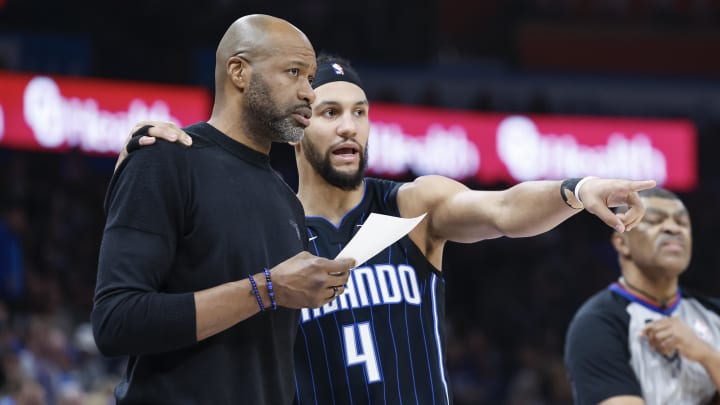Jan 13, 2024; Oklahoma City, Oklahoma, USA; Orlando Magic guard Jalen Suggs (4) talks to head coach Jamahl Mosley during the second quarter at Paycom Center. Mandatory Credit: Alonzo Adams-USA TODAY Sports