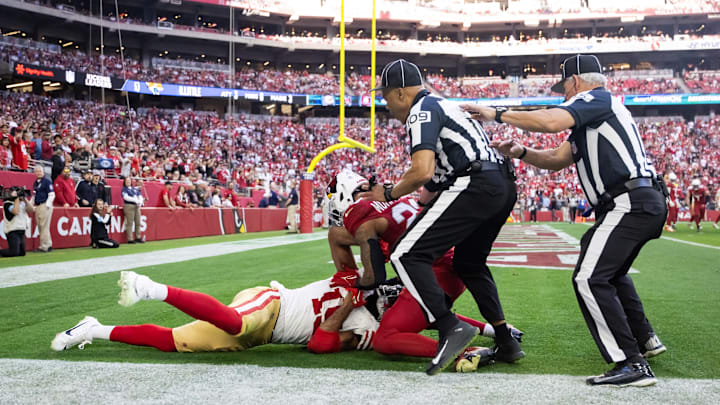 Jan 5, 2025; Glendale, Arizona, USA; San Francisco 49ers wide receiver Jauan Jennings (15) fight against Arizona Cardinals cornerback Sean Murphy-Bunting (23) in the first half at State Farm Stadium. Mandatory Credit: Mark J. Rebilas-Imagn Images