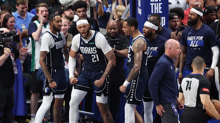 May 26, 2024; Dallas, Texas, USA; Dallas Mavericks center Daniel Gafford (21) reacts with forward P.J. Washington (25) and forward Derrick Jones Jr. (55) in the second half against the Minnesota Timberwolves during game three of the western conference finals for the 2024 NBA playoffs at American Airlines Center. Mandatory Credit: Kevin Jairaj-USA TODAY Sports