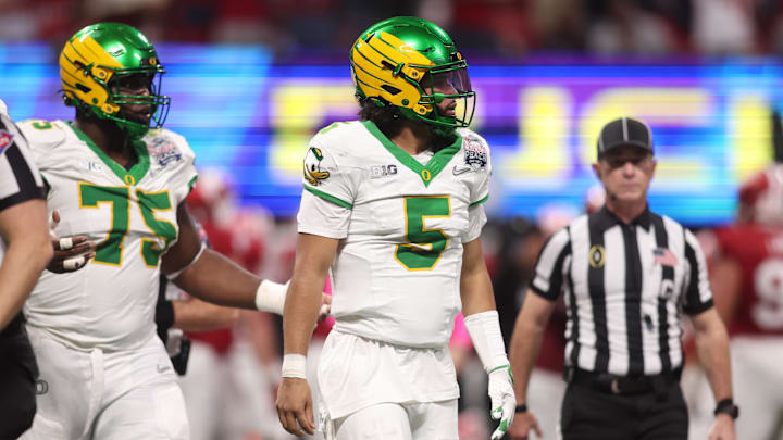 Jan 9, 2026; Atlanta, GA, USA; Oregon Ducks quarterback Dante Moore (5) reacts after a fumble against the Indiana Hoosiers during the first half of the 2025 Peach Bowl and semifinal game of the College Football Playoff at Mercedes-Benz Stadium. Mandatory Credit: Brett Davis-Imagn Images