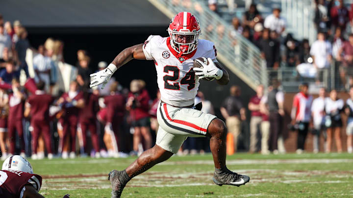 Nov 8, 2025; Starkville, Mississippi, USA; Georgia Bulldogs running back Bo Walker (24) runs with the ball against the Mississippi State Bulldogs during the second half at Davis Wade Stadium at Scott Field. Mandatory Credit: Wesley Hale-Imagn Images