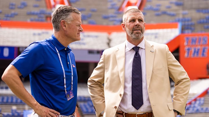 Sep 14, 2024; Gainesville, Florida, USA; Florida Gators athletic director Scott Stricklin (left) and head coach Billy Napier talk before a game against the Texas A&M Aggies at Ben Hill Griffin Stadium. Mandatory Credit: Matt Pendleton-Imagn Images Sep 14, 2024; Gainesville, Florida, USA; Florida Gators athletic director Scott Stricklin (left) and head coach Billy Napier talk before a game against the Texas A&M Aggies at Ben Hill Griffin Stadium. Mandatory Credit: Matt Pendleton-Imagn Images