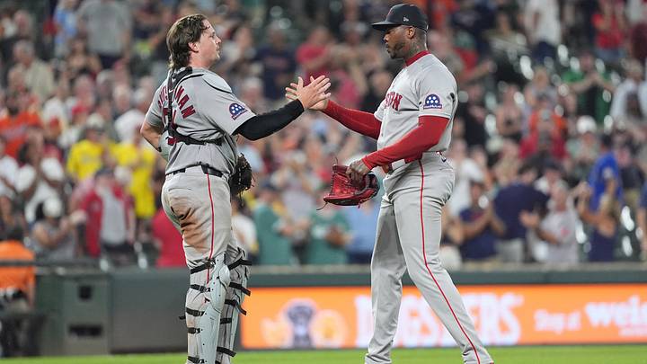 Sep 3, 2026; Baltimore, Maryland, USA;  Boston Red Sox catcher Adley Rutschman (31) and Boston Red Sox pitcher Aroldis Chapman (44) celebrate the victory against the Baltimore Orioles after the ninth inning at Oriole Park at Camden Yards.  Mandatory Credit: Gregory Fisher-Imagn Images