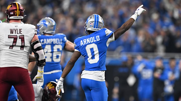 Jan 18, 2025; Detroit, Michigan, USA; Detroit Lions corner back Terrion Arnold (0) celebrates after a fourth down stop against the Washington Commanders during the first quarter in a 2025 NFC divisional round game at Ford Field. Mandatory Credit: Lon Horwedel-Imagn Images