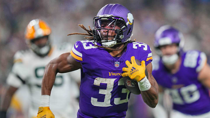 Dec 29, 2024; Minneapolis, Minnesota, USA; Minnesota Vikings running back Aaron Jones (33) runs with the ball against Green Bay Packers in the third quarter at U.S. Bank Stadium. Mandatory Credit: Brad Rempel-Imagn Images Dec 29, 2024; Minneapolis, Minnesota, USA; Minnesota Vikings running back Aaron Jones (33) runs with the ball against Green Bay Packers in the third quarter at U.S. Bank Stadium. Mandatory Credit: Brad Rempel-Imagn Images