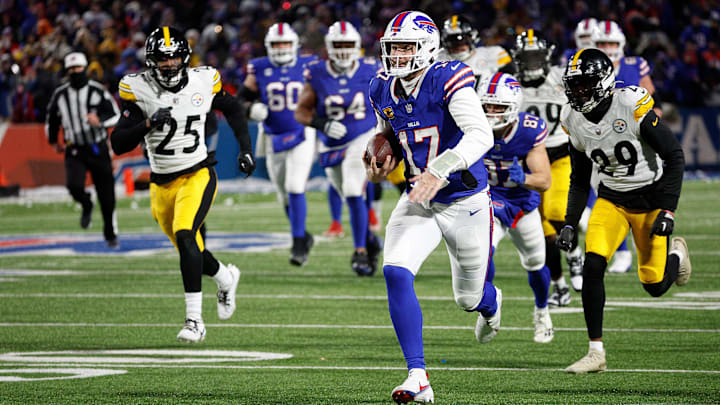 Buffalo Bills quarterback Josh Allen (17) runs 52 yards for a touchdown in a 31-17 playoff win over the Steelers.