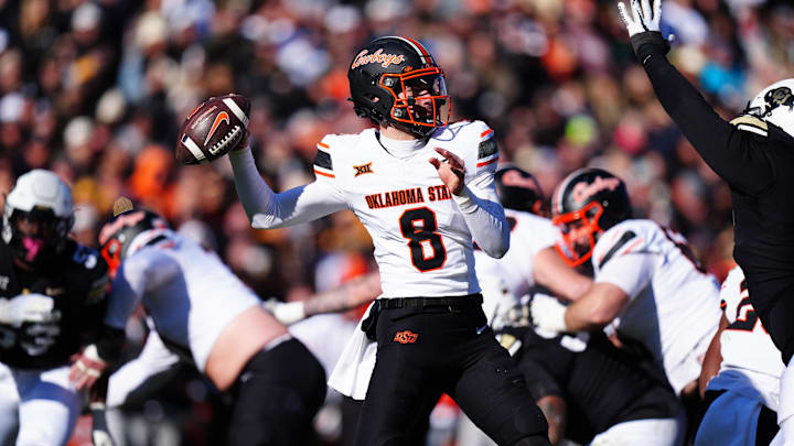 Nov 29, 2024; Boulder, Colorado, USA; Oklahoma State Cowboys quarterback Maealiuaki Smith (8 prepares to pass the ball in the second quarter against the Colorado Buffaloes at Folsom Field. Mandatory Credit: Ron Chenoy-Imagn Images Nov 29, 2024; Boulder, Colorado, USA; Oklahoma State Cowboys quarterback Maealiuaki Smith (8 prepares to pass the ball in the second quarter against the Colorado Buffaloes at Folsom Field. Mandatory Credit: Ron Chenoy-Imagn Images