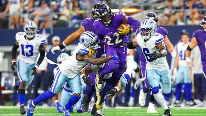 Baltimore Ravens running back Derrick Henry (22) runs during the first half as Dallas Cowboys safety Donovan Wilson (6) and Dallas Cowboys cornerback Jourdan Lewis (2) defend at AT&T Stadium.