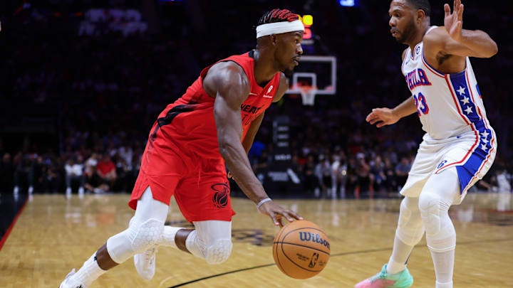 Nov 18, 2024; Miami, Florida, USA; Miami Heat forward Jimmy Butler (22) drives to the basket against Philadelphia 76ers guard Eric Gordon (23) during the second quarter at Kaseya Center. Mandatory Credit: Sam Navarro-Imagn Images