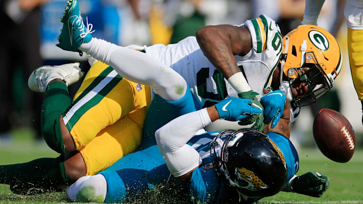 Green Bay Packers linebacker Edgerrin Cooper breaks up a pass to Jacksonville Jaguars wide receiver Christian Kirk.