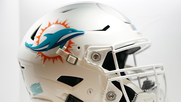 Jul 20, 2021; Miami Gardens, FL, USA; A general view of a Miami Dolphins helmet in the locker room during the grand opening at Baptist Health Training Complex. Mandatory Credit: Jasen Vinlove-Imagn Images Jul 20, 2021; Miami Gardens, FL, USA; A general view of a Miami Dolphins helmet in the locker room during the grand opening at Baptist Health Training Complex. Mandatory Credit: Jasen Vinlove-Imagn Images