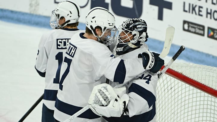 Penn State Nittany Lions defenseman Jackson Smith (7) celebrates with goaltender Joshua Fleming (34) after beating the Clarkson Golden Knights at Pegula Ice Arena. Penn State Nittany Lions defenseman Jackson Smith (7) celebrates with goaltender Joshua Fleming (34) after beating the Clarkson Golden Knights at Pegula Ice Arena.