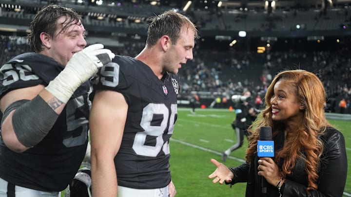 Dec 22, 2024; Paradise, Nevada, USA; CBS Sports sideine reporter AJ Ross interviews Las Vegas Raiders tight end Brock Bowers (89) and guard Jackson Powers-Johnson (58) after the game against the Jacksonville Jaguars Allegiant Stadium. Mandatory Credit: Kirby Lee-Imagn Images