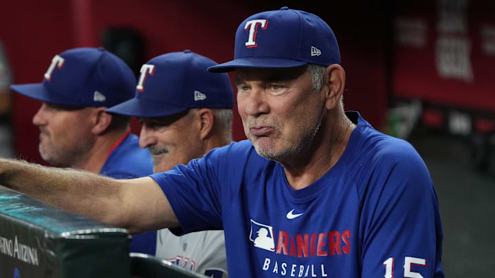 Texas Rangers manager Bruce Bochy (15) watches from the dugout against the Arizona Diamondbacks in the first inning at Chase Field. Texas Rangers manager Bruce Bochy (15) watches from the dugout against the Arizona Diamondbacks in the first inning at Chase Field.
