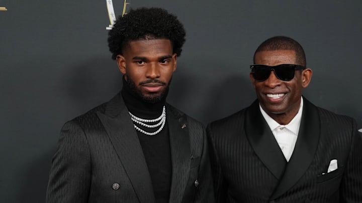 Deion Sanders with his son Shedeur Sanders on the red carpet before Super Bowl LIX NFL Honors.