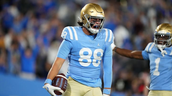 Oct 28, 2023; Pasadena, California, USA; UCLA Bruins tight end Moliki Matavao (88) celebrates after scoring on a 26-yard touchdown reception against the Colorado Buffaloes in the second half at Rose Bowl. UCLA defeated Colorado 28-16. Mandatory Credit: Kirby Lee-Imagn Images