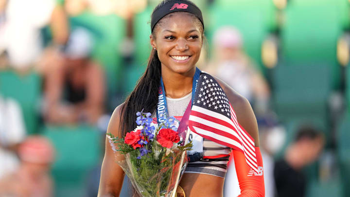 Gabby Tnomas poses with gold medal after winning the women's 200m in a meet-record 21.61 during the US Olympic Team Trials.