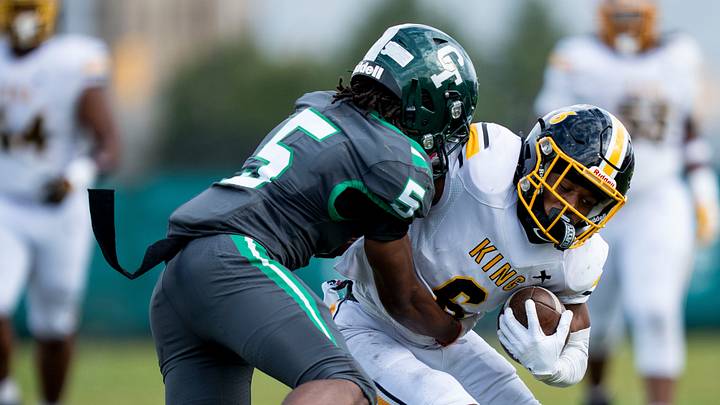 King senior wide receiver De’Andre Williams (6) is tackled by Cass Tech junior athlete Marquell Evans Jr. (5) during the first quarter of a high school football game between Cass Tech and Detroit King at Cass Technical High School in Detroit on Friday, Sept. 25, 2026. King senior wide receiver De’Andre Williams (6) is tackled by Cass Tech junior athlete Marquell Evans Jr. (5) during the first quarter of a high school football game between Cass Tech and Detroit King at Cass Technical High School in Detroit on Friday, Sept. 25, 2026.