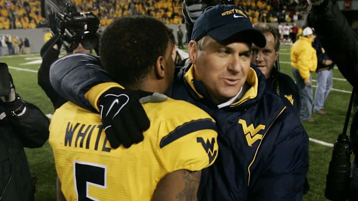 West Virginia Mountaineers head coach Rich Rodriguez hugs quarterback White after defeating the Louisville Cardinals in 2007.